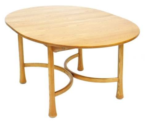 An Ercol elm draw leaf dining table, the oval top raised on turned outswept legs, united by an x framed stretcher, Saville range model number 26, 74cm high, 162cm wide, 212cm extended, 108cm deep.,