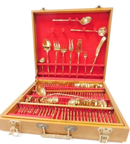 A suite of Thai brass cutlery, and with serving implements, for twelve place settings, with stamped makers mark and Thailand, 144 pieces, in a fitted teak canteen carry case.