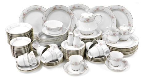 A Noritake Dreams Street pattern porcelain dinner and tea service, including teapot, serving dishes, etc., decorated with bands of flowering and trellis decoration. (96 pieces)