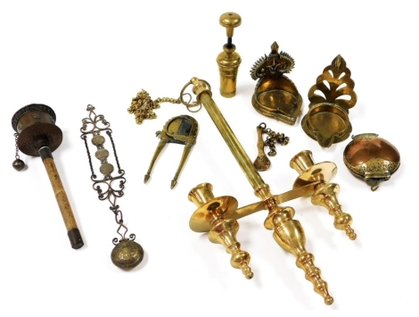 A 19thC Middle Eastern brass betel nut cutter, other brass and copper implements, a hanging double candle lamp, etc.