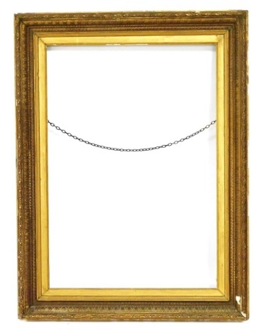 A Victorian gilt wood and gesso rectangular picture frame, with gilt slip, aperture 90cm x 62cm.