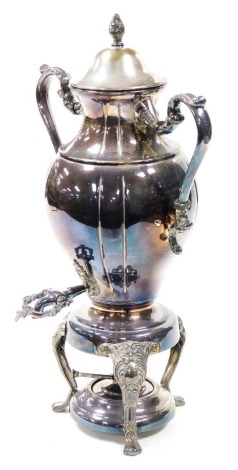 A Victorian silver plated tea urn and cover, of twin handled baluster form, raised on three cabriole legs, with burner, 51cm high.