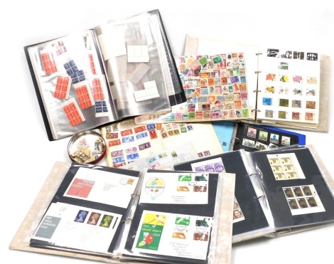 Philately. British and World stamps, including George V and later definitives, Machins, and commemoratives, some blocks, first day covers, etc., in five albums and loose.