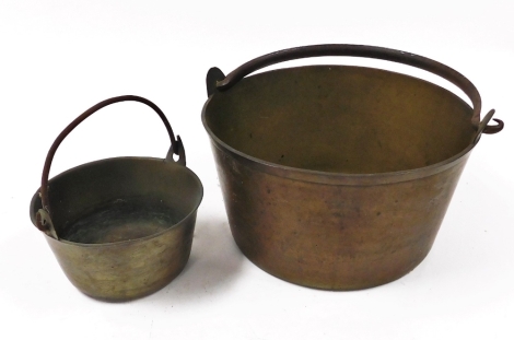 A Victorian brass preserve pan, and another smaller.