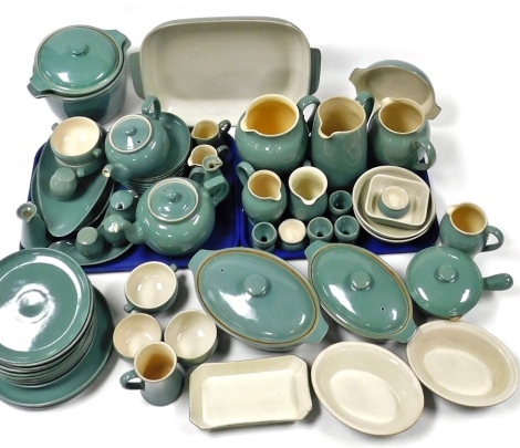 A Denby Manor Green pattern pottery part dinner and tea service, including casserole dishes and covers, lasagne dish, water, milk and cream jugs, teapots, condiments, plates, etc., (quantity).