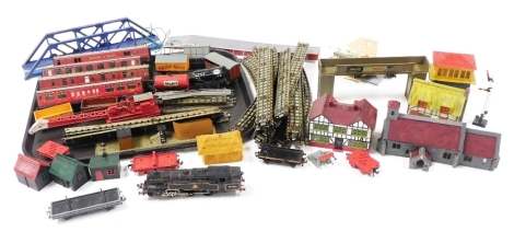 A group of model railway related items, to include tin plate track, locomotives, tender, various buildings, etc. (2 trays)