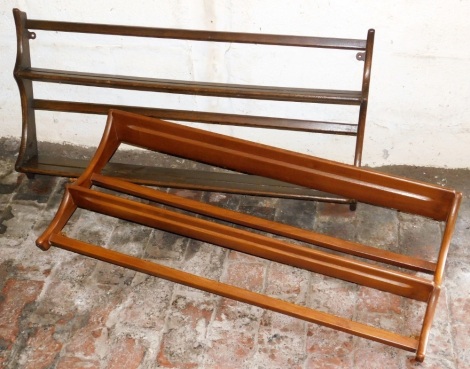 An Ercol light elm wall mounted plate rack, and another in dark elm, both 96cm wide.