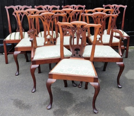 Ten Chippendale style mahogany dining chairs, with drop in seats, raised on cabriole legs, comprising a pair of carvers and eight single chairs.