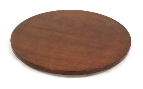 A sapele circular lazy Susan, 83cm diameter.