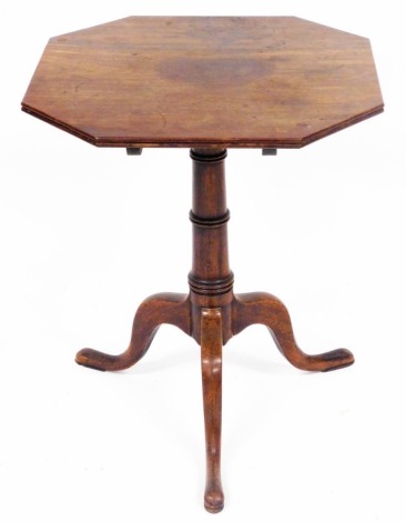 A George III mahogany tilt top occasional table, with an octagonal top, raised on a turned column over three cabriole legs, 62cm high, 52cm wide.