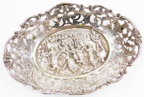 A Dutch silver dish, of shaped oval form, embossed centrally with a scene depicting figures dancing, the raised edge with pierced leaf decoration, bears marks, 3.82oz, 16.5cm wide.