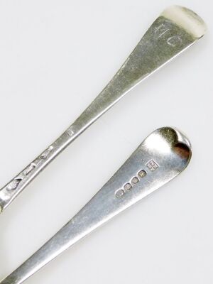 A Georgian silver rat-tail pattern serving spoon, hallmarks rubbed, 1.93oz, and a George III silver cream ladle, engraved crest, with ribbed banding, William Eley I & William Fearn, London 1807, 2.18oz, 17.5cm long. - 2