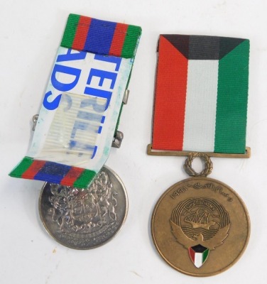 A Kuwaiti Liberation medal, together with a WWII Canadian Volunteer Overseas medal. (2) NB. Lots 1 to 50 in this auction are being sold with proceeds of sale being donated to Woody' Lodge Registered Charity (1173752) fund raising to continue their support - 2