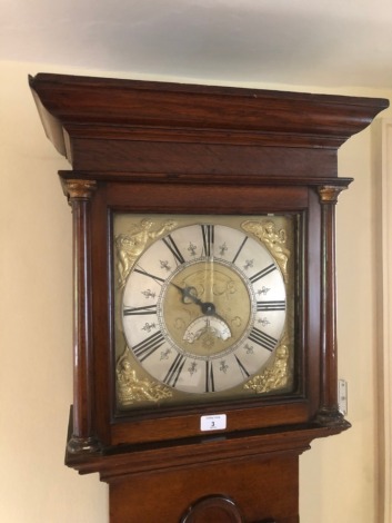 A George III oak longcase clock, with moulded cornice and inset pillared hood, full length moulded arched trunk door, and plain base with added bracket foot, the 28cm square dial having applied figures to the spandrels depicting the Four Seasons, the silv