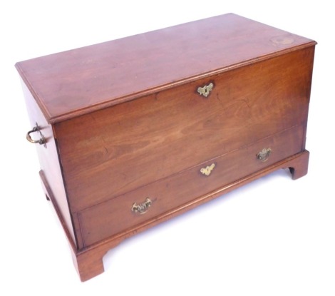 A George III mahogany mule chest, with brass carrying handles, with a hinged lid, the front with dummy drawer, raised on bracket feet, 76cm high, 124cm wide, 63.5cm deep.