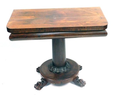 A William IV rosewood card table, with canted corners, on a moulded support, with column base, terminating in ball and claw feet, 74cm high, 91cm wide, 45cm deep.