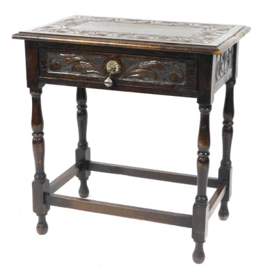 A Victorian Carolean style oak side table, with a carved sunburst border to top, over foliate carved frieze drawer, raised on baluster turned legs united by a box stretcher, 72cm high, 69cm wide, 44cm deep.