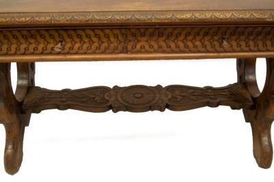 A 19thC Italian walnut centre table, with demi lune carved top, frieze drawers with carved decoration, refectory slab ends and carved stretcher, 78cm high, 129cm wide, 73cm deep. - 3