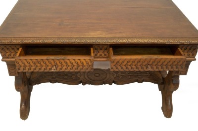 A 19thC Italian walnut centre table, with demi lune carved top, frieze drawers with carved decoration, refectory slab ends and carved stretcher, 78cm high, 129cm wide, 73cm deep. - 4