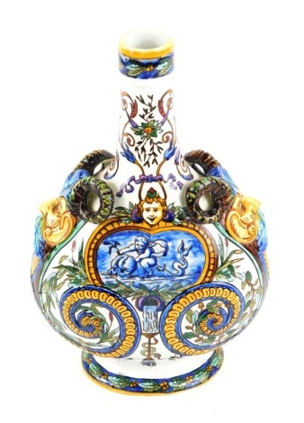 A late 19thC Gien faience pilgrim flask, with twin mask handles, moulded and painted with a cherub riding a dolphin, masks, rushes, oak leaves, and symbols of war, printed mark, 26.5cm high.