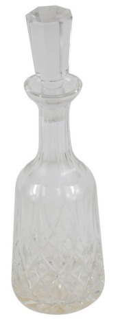 A Waterford cut glass decanter and stopper, decorated in the Lismore pattern, etched mark, 33.5cm high.