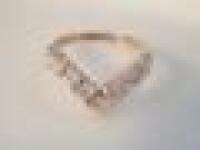 A 9ct gold nine stone cz wishbone ring