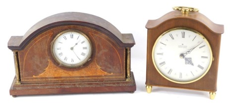 An Edwardian mahogany and burr walnut mantel clock, circular enamel dial bearing Roman numerals, clockwork movement by Duverdry and Bloquel, the case of domed form, with brass pillar supports, raised on a stepped rectangular base, on brass ball feet, 20cm