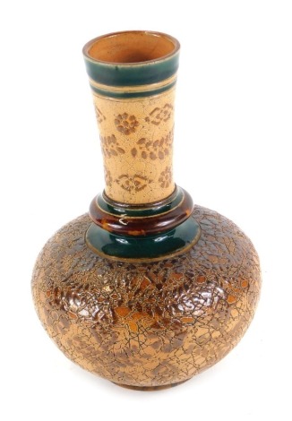 A Doulton Slater's stoneware vase, decorated with flowers within green and brown bands, impressed marks, 23cm high.