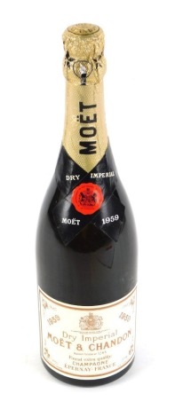 A bottle of Moet & Chandon Dry Imperial Champagne 1959.