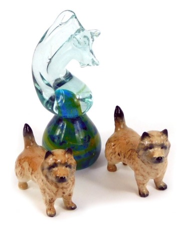 A pair of Beswick figures of Cairn terriers, together with a Mdina glass paperweight modelled as a seahorse, 16.5cm high. (3)