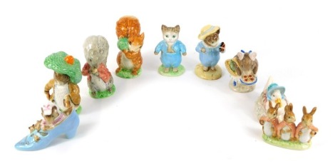 Nine Beswick Beatrix Potter figures, comprising Benjamin Bunny and Timmy Tiptoes, brown back stamp, together with The Old Woman Who Lived in a Shoe and Flopsy Mopsy and Cotton Tail, gold back stamps. (9)