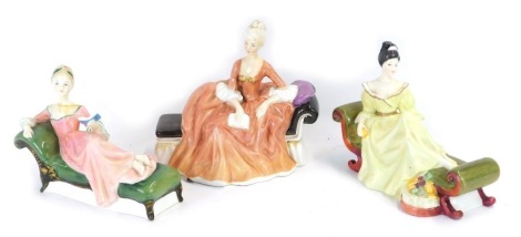 Three Royal Doulton figures, comprising Reverie, HN2306, Repose, HN2272, and At Ease, HN2473.