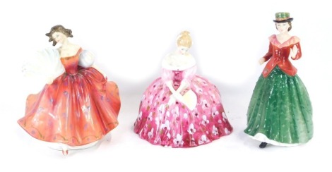 Three Royal Doulton figures, comprising First Waltz, HN2862, Victoria, HN2471, and Holly, HN3647.