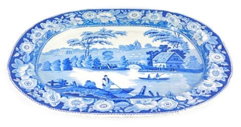 An early 19thC blue and white meat platter, decorated in the Neunham Courtney pattern, 49.5cm wide.