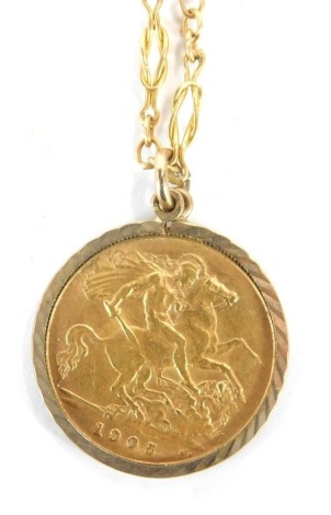 An Edward VII half gold sovereign pendant, dated 1905, in a 9ct gold mounted frame, on a yellow metal fancy link neck chain with barrel clasp, unmarked, 42cm long, 9.3g all in.