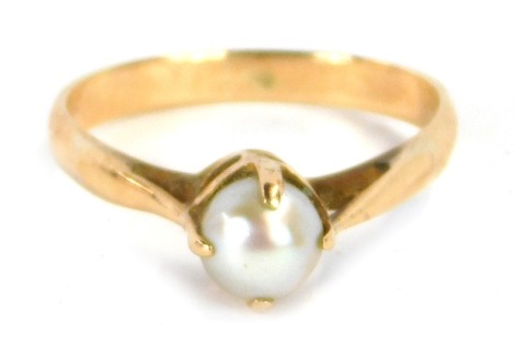 A cultured pearl dress ring, with single cultured pearl in a four claw raised basket setting, with pierced design shoulders, ring size L, yellow metal unmarked, 2.5g all in.