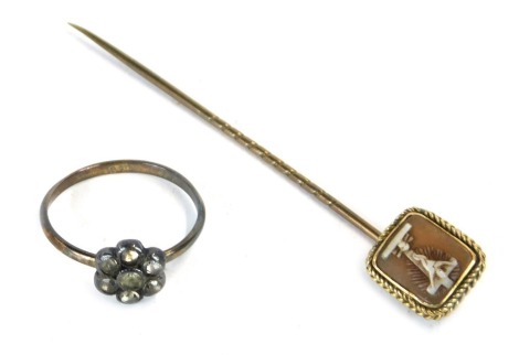 A stick pin, with inset cameo top depicting Jesus Christ on the cross, on a yellow metal pine, unmarked, 2.2g all in, and a 9ct gold white stone set floral cluster ring, ring size M½, 3.9g all in. (2)