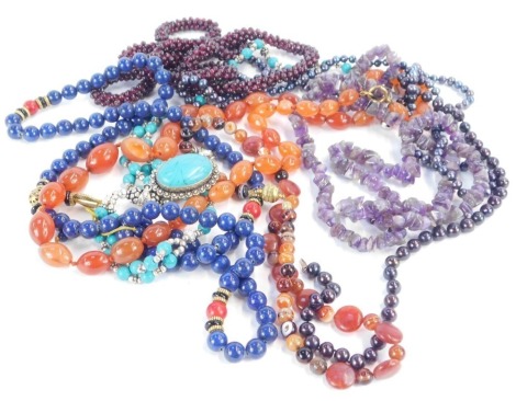 A quantity of hardstone and other necklaces, comprising orange agate necklace, amethyst style beaded necklace, lapis necklace, etc. (1 box)