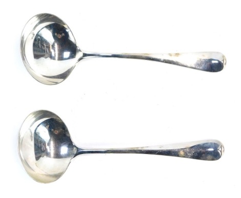 A pair of George VI silver Fiddle pattern serving ladles, each with a fluted bowl, maker CB&S, Sheffield 1943, in presentation Pearce and Sons of Leicester jeweller's box, 2.46oz.