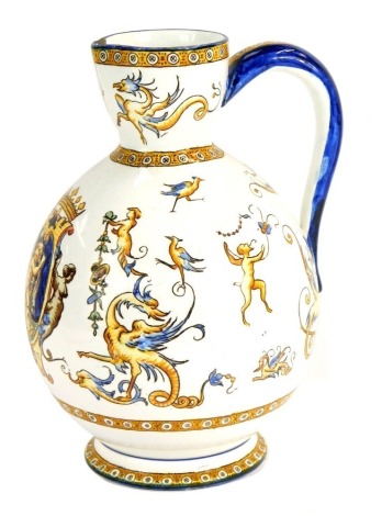 A Gien faience pottery ewer, painted with a coat of arms, griffins and other figures, printed marks, 27cm high.