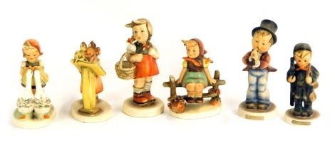 Six Hummel pottery figures, to include children playing instruments, children playing, etc. (AF)