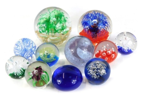 A group of glass paperweights, comprising two marked Caithness, bubble and flower design, large and medium dumps. (1 tray)