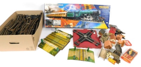 OO railway related items, comprising an empty Flying Scotsman box, various O gauge track, level crossings, railway buildings, etc. (3 boxes)