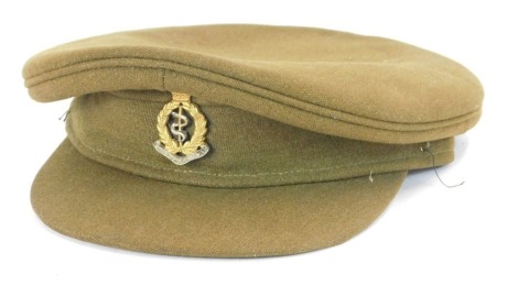 A 1950's Royal Army Medical Corps officer's cap, with mottled green stamped Bates Service Cap.