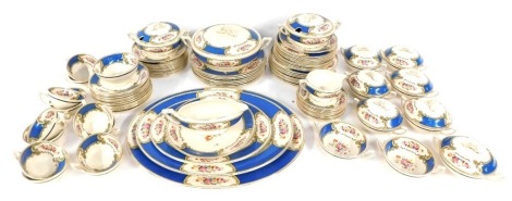 A Royal Crown Myott part tea service, on Royal blue ground with cream and gilt floral borders, comprising tea cups, saucers, graduated plates, dinner plates, gravy boat, etc. (a quantity)