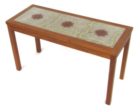 A late 20thC vintage teak and tile top coffee table, inset with three tiles, raised on square legs, 46cm high, 82.5cm wide, 33cm deep.