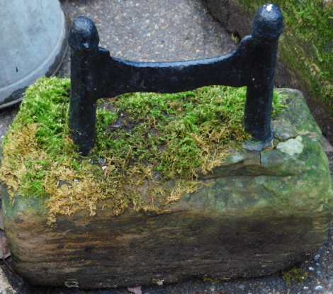 A stone and cast metal boot scraper, 30cm high. (AF)