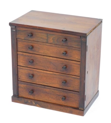 A 19thC rosewood apprentice piece tabletop Wellington chest, with five drawers and bun handles, on a plinth, 42cm high, 39cm wide, 25cm deep.