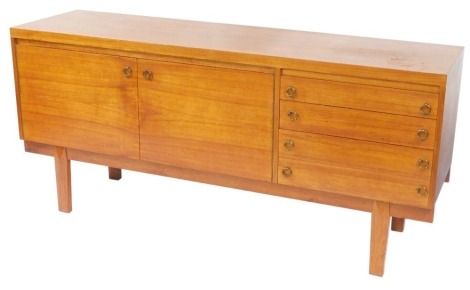 A retro teak sideboard, with arrangement of two cupboards and four drawers and taper legs, 78cm high, 167cm wide, 46cm deep.