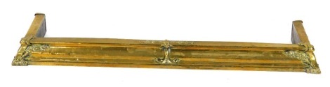 A late 19thC brass fire curb, 110cm wide.